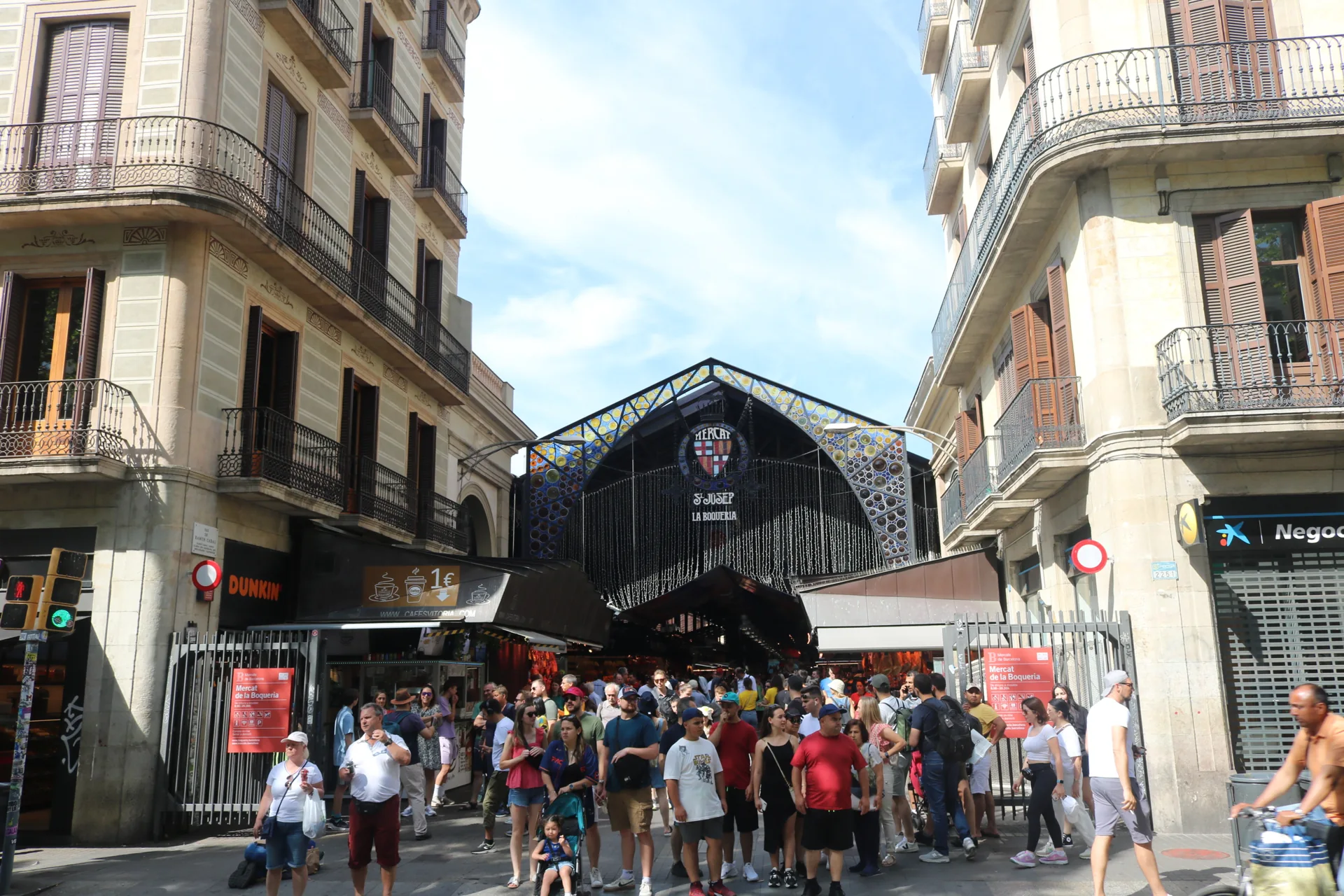 Visitors at the entrance of La Boqueria market in Barcelona