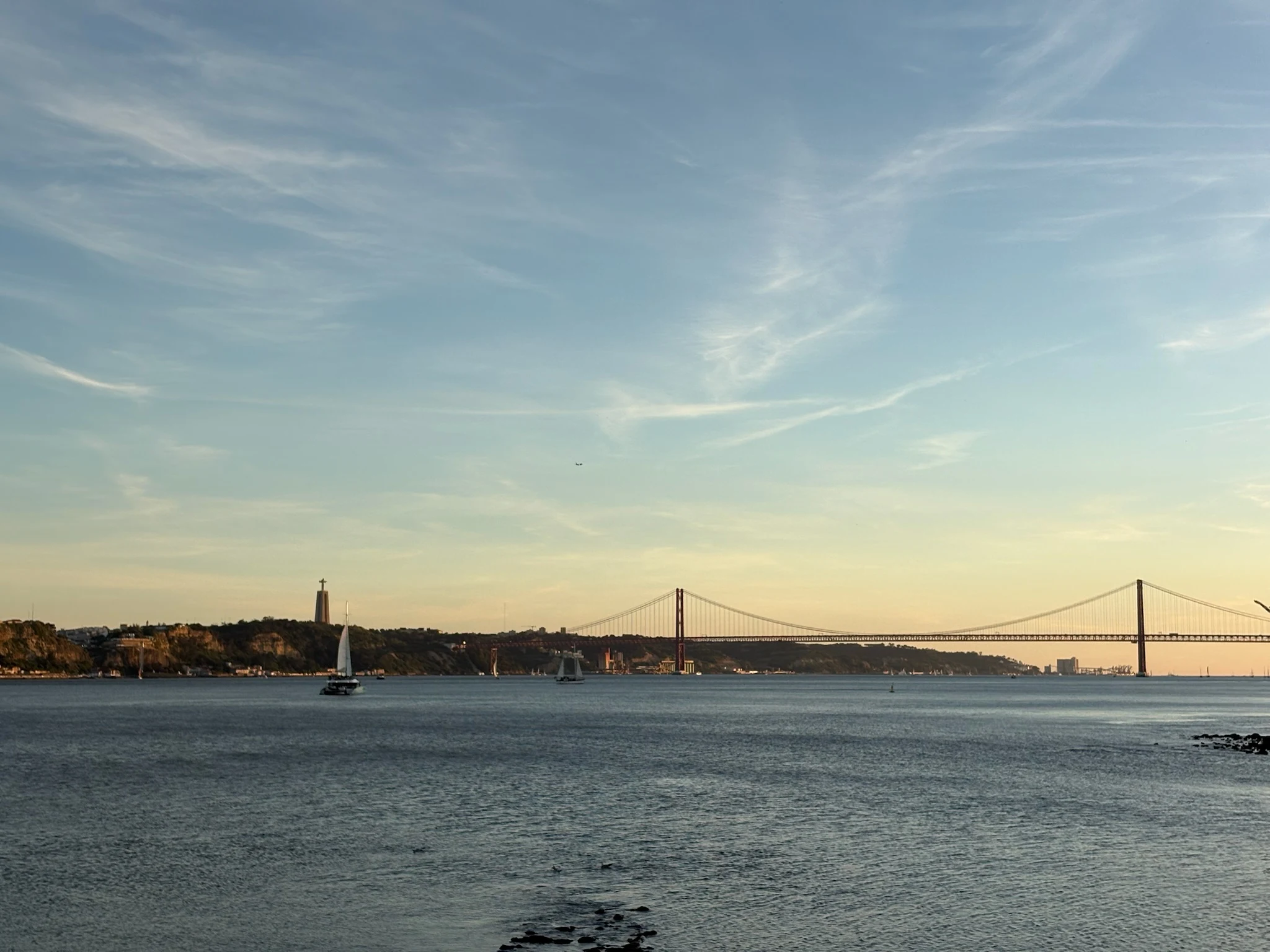 Lisbon across the river beneath an evening sky